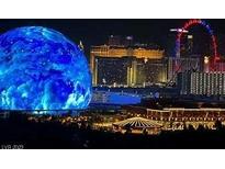 Panoramic nighttime view of the Las Vegas strip featuring the MSG Sphere and the High Roller observation wheel at 725 N Royal Crest Cir # 227, Las Vegas, NV 89169