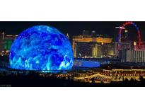 Illuminated Sphere, Las Vegas skyline, and the High Roller Ferris wheel create a stunning night view at 725 N Royal Crest Cir # 227, Las Vegas, NV 89169