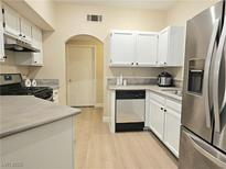 Bright kitchen featuring white cabinets, stainless steel appliances, and modern countertops at 9000 S Las Vegas Blvd # 1187, Las Vegas, NV 89123