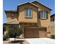 Two-story home with tan stucco, brown trim, and a two-car garage at 3104 Naggio Shores Ave, Las Vegas, NV 89141