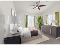Bright bedroom featuring a ceiling fan, a large bed with a brown throw, and neutral-colored walls at 8426 Sluman Ct, Las Vegas, NV 89128