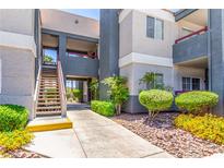 Well-maintained building exterior featuring tidy landscaping and a welcoming walkway at 8600 W Charleston Blvd # 2190, Las Vegas, NV 89117