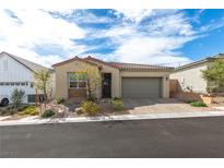 Charming single-story home with a two-car garage and low-maintenance desert landscaping at 9993 Skye Gazer Ave, Las Vegas, NV 89166