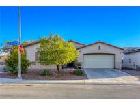 Charming single-story home featuring a two-car garage and well-maintained landscaping in a suburban neighborhood at 1809 Lazy Hill Ranch Way, North Las Vegas, NV 89081