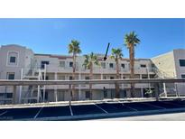 Exterior view of the property showing the building and palm trees in front at 2064 Mesquite Ln # 303, Laughlin, NV 89029