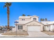 Charming two-story home featuring a two-car garage and a well-maintained, xeriscaped front yard at 3425 Golden Sage Dr, North Las Vegas, NV 89032