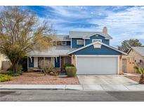 Charming two-story home with a well-maintained front yard and a two car garage at 4322 Satinwood Dr, Las Vegas, NV 89147