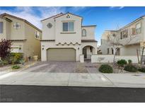 Charming two-story home with a well-maintained front yard and a two-car garage at 8043 Tank Loop St, Las Vegas, NV 89166