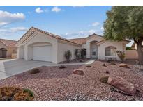 Charming single-story home with a well-maintained xeriscaped front yard and a two car garage at 8101 Deep Stone Ave, Las Vegas, NV 89149