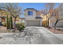 Charming two-story home featuring a well-maintained front yard and a two-car garage at 1157 Cactus Rock St, Henderson, NV 89011