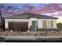 Charming single-story home featuring a two-car garage, neutral stucco, and brick accents against a colorful sunset at 134 Castanet Ln # Lot 234, Henderson, NV 89015