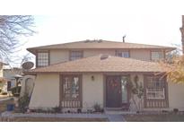 Inviting two-story home featuring neutral siding, a welcoming front door, and well-maintained landscaping at 1351 Dorothy Ave # 3, Las Vegas, NV 89119
