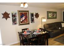 Stylish dining area featuring modern table setting, wine racks, and decorative artwork at 2048 Mesquite Ln # 303, Laughlin, NV 89029