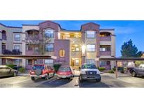 Exterior of a modern condo building with assigned parking and well-maintained landscaping at 6955 N Durango Dr # 3019, Las Vegas, NV 89149