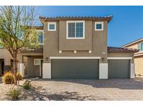 Charming two-story home featuring a three-car garage and a beautifully paved driveway at 7909 Warm Winds St, North Las Vegas, NV 89084