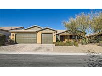 Charming single-story home with a three-car garage and desert landscaping at 8514 Garnet Lake Ave, Las Vegas, NV 89113