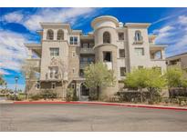 Attractive condominium building featuring multiple stories, balconies, and well-maintained landscaping at 9220 Tesoras Dr # 401, Las Vegas, NV 89144