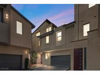 Contemporary townhomes feature private garages and modern architectural design in a desirable community at 11357 Gravitation Dr, Las Vegas, NV 89135