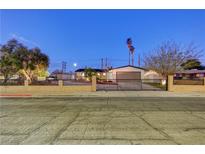 Charming single story home featuring mature trees, a two car garage and secure fencing at 1401 S 17Th St, Las Vegas, NV 89104