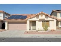 Charming single-story home with solar panels, a two-car garage and low maintenance landscaping in a sunny neighborhood at 1418 Lodgepole Dr, Henderson, NV 89014