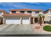 Inviting two-story home with a terracotta-tiled roof and a convenient two-car garage at 1730 Juniper Twig Ave, Las Vegas, NV 89183