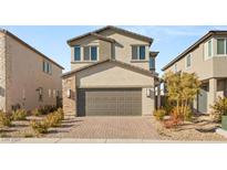 Charming two-story home with a two-car garage and desert landscaping at 2720 High Echelon Rd, North Las Vegas, NV 89086