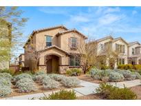 Charming two-story home featuring a stone-accented entrance and well-maintained landscaping at 3016 Via Contessa, Henderson, NV 89044