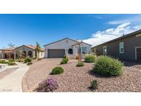 Charming single-story home with desert landscaping and a brick-paved driveway at 792 Drammatico Pl, Henderson, NV 89011