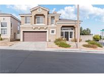 Two-story home with a two-car garage, manicured front yard, and inviting entrance at 917 Corsica Ln, Las Vegas, NV 89144