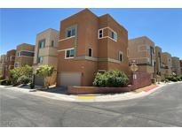 Modern three-story home showcasing a contemporary design, tidy landscaping, and an attached garage at 10537 Headwind Ave, Las Vegas, NV 89129