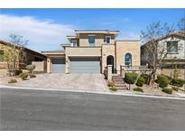 Stunning two-story home featuring a three-car garage, neutral stucco, and stone accents on a beautifully landscaped lot at 11834 Albissola Ave, Las Vegas, NV 89138