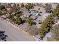 Expansive aerial view of a private estate with lush landscaping, a sparkling pool, and mature trees at 2900 Thurman Ave, Las Vegas, NV 89120