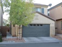 Charming two-story home featuring a two-car garage and a well-maintained front yard at 5481 Railroad River Ave, Las Vegas, NV 89139