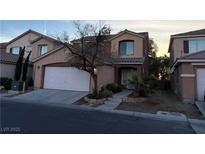 Charming two-story home featuring a garage and landscaped front yard at 5525 Nickel Ridge Way, Las Vegas, NV 89122