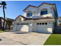 Stunning two-story home featuring a three-car garage and a beautifully landscaped yard at 8132 Bay Harbor Dr, Las Vegas, NV 89128