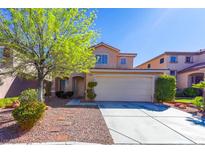 Charming two-story home with a well-maintained front yard and a two car garage at 9849 Ridge Hill Ave, Las Vegas, NV 89147