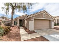 Charming single-story home with a two-car garage and low-maintenance desert landscaping at 2175 Point Mallard Dr, Henderson, NV 89012