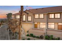 Charming townhouse with a red tile roof, stucco exterior, and well-maintained landscaping at 3426 Dry Gulch Dr, Laughlin, NV 89029
