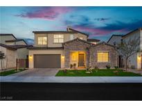 Charming two-story home with stone accents, well-maintained landscaping, and a two-car garage at 350 Gandara St, Las Vegas, NV 89138