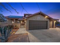 Charming single-Gathering home boasts a tile roof, three-car garage and solar panels at 5690 N Park St, Las Vegas, NV 89149