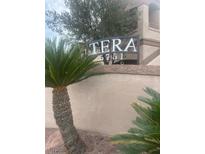 The Tera community signage with desert landscaping against a neutral color scheme adds welcoming curb appeal at 5751 E Hacienda Ave # 159, Las Vegas, NV 89122