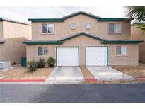 Well-maintained home featuring two garages and desert landscaping for a clean, appealing look at 5771 Ritter Ln, Las Vegas, NV 89118