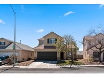 Charming two-story home featuring an attached two-car garage and desert landscaping at 8125 Boxberry Ave, Las Vegas, NV 89131