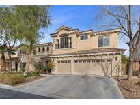 Elegant two-story home with a spacious three-car garage and a meticulously maintained front yard at 10748 Aldrovandi Dr, Las Vegas, NV 89141