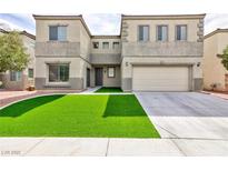 Charming home features a two car garage, well maintained lawn, and neutral color palette at 1717 Chase Glenn Ct, North Las Vegas, NV 89086