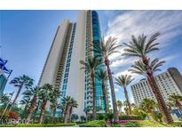 Stunning high rise exterior view with palm trees and lush landscaping on a bright, sunny day at 322 Karen Ave # 708, Las Vegas, NV 89109