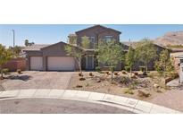 Beautiful two-story home with a three-car garage and professionally landscaped front yard at 4001 Turquoise Falls St, Las Vegas, NV 89129