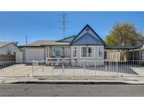 Charming single-story home with well-maintained landscaping, a fence, and a covered parking area at 5607 Tunis Ave, Las Vegas, NV 89122