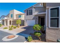 Charming two-story home featuring desert landscaping, brick paver driveway, and a bright, inviting entrance at 816 Stannard Ct, Henderson, NV 89052