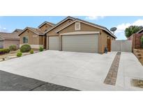 Charming single-story home featuring a three-car garage and well-maintained landscaping and concrete driveway at 8319 Browns Mountain Ct, Las Vegas, NV 89131